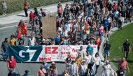 Demonstrators take part in a march in Irun on August 24, 2019, to protest against the annual G7 Summit attended by the leaders of the world's seven richest democracies, Britain, Canada, France, Germany, Italy, Japan and the United States in Biarritz from 