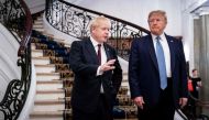 US President Donald Trump (R) and Britain's Prime Minister Boris Johnson speak before a working breakfast at the G7 Summit in Biarritz, France on August 25, 2019, on the second day of the annual G7 Summit attended by the leaders of the world's seven riche