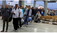 Palestinian workers wait to cross the Israeli-controlled Al-Jalama checkpoint as they head to work in Israel, near Jenin in the Israeli-occupied West Bank.