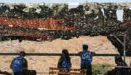 U.N peacekeepers of the United Nations Interim Force in Lebanon (UNIFIL) sit together in al-Wazzani area in southern Lebanon, Lebanon August 26, 2019. REUTERS/Ali Hashisho