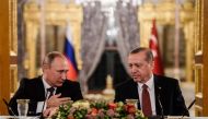 Russian President Vladimir Putin speaking to Turkish President Recep Tayyip Erdogan as they attend a press conference in Istanbul, October 10, 2016. AFP/Ozan Kose