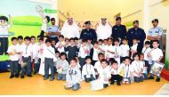 The officials of the General Directorate of Traffic, during a visit to Jawaan Bin Jassim Model Kindergarten for Boys in Al Dafna.