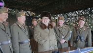 North Korea’s Kim Jong Un with military officers as he observes a drill in a photo by Korean Central News Agency on March 25 2016. KCNA/REUTERS