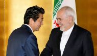 Japan's Prime Minister Shinzo Abe greets Iran's Foreign Minister Mohammad Javad Zarif at the start of their bilateral meeting in Yokohama, south of Tokyo, Japan August 28, 2019, in this photo released by Kyodo. Kyodo/via REUTERS 