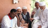Relatives of victims killed during a flash flood mourn in the southern Moroccan city of Tizert, on August 29, 2019.  AFP 