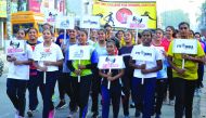 Indian students hold placards as they take part in a walk the first day of the 