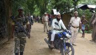 Security personnel patrol on a road ahead of the publication of the final draft of the National Register of Citizens (NRC) at Kachari Para village, in Hojai district, of Assam August 30, 2019. Reuters/Anuwar Hazarika
 