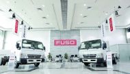 FUSO trucks on display in the showroom. 