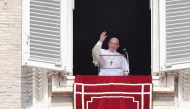 Pope Francis waves from the window of the apostolic palace overlooking St. Peter's square during the weekly Angelus prayer on September 1, 2019 at the Vatican. / AFP / Tiziana FABI