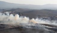 Smoke rises from shells fired from Israel in Maroun Al-Ras village, near the border with Israel, in southern Lebanon, September 1, 2019. REUTERS/Aziz Taher	