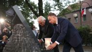 German President Frank-Walter Steinmeier and Polish President Andrzej Duda light candles at a World War II memorial as part of the commemorations on September 1, 2019 in Wielun AFP Krzysztof Sitkowski 