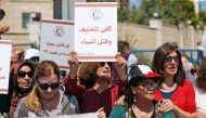 Palestinian women protest in support of women’s rights outside the prime minister’s office in the West Bank city of Ramallah on September 2, 2019, after a young Palestinian died in a case that has raised emotions. AFP / ABBAS MOMANI