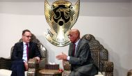 German Foreign Minister Heiko Maas (L) meets with Sudan's Foreign Ministry Undersecretary Omar Dahab Fadel upon the former's arrival at Khartoum International Airport outside the Sudanese capital on September 3, 2019. / AFP / Ebrahim HAMID 