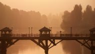 A Kashmiri man walks on a bridge during restrictions after scrapping of the special constitutional status for Kashmir by the Indian government, in Srinagar September 1, 2019. Reuters/Danish Ismail