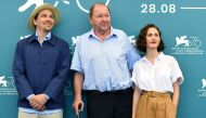 Swedish director Roy Andersson (C),  actors Anders Hellstrom (L)  actress Tatiana Delaunay pose during the photocall for the movie 