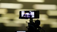 Protesters holding a news conference are displayed in camera and phone screens in Hong Kong, China, September 4, 2019. Reuters/Amr Abdallah Dalsh
 