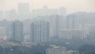 FILE PHOTO: Public housing apartment blocks are shrouded by haze in Singapore September 13, 2019. REUTERS/Feline Lim
