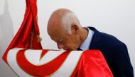 Presidential candidate Kais Saied kisses a Tunisian flag after unofficial results during the Tunisian presidential election in Tunis, September 15, 2019. Reuters/Zoubeir Souissi