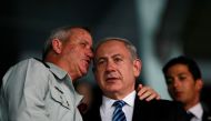Benjamin Netanyahu (R) and Benny Gantz speak during the opening ceremony of the 19th Maccabiah Games at Teddy Stadium in Jerusalem July 18, 2013. Reuters/Baz Ratner