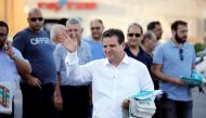 Ayman Odeh, leader of the Joint List, gestures as he hands out pamphlets during an an election campaign event in Tira, northern Israel September 5, 2019. Reuters/Amir Cohen