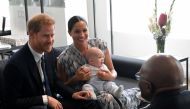 Britain's Prince Harry and his wife Meghan, Duchess of Sussex, holding their son Archie, meet Archbishop Desmond Tutu at the Desmond & Leah Tutu Legacy Foundation in Cape Town, South Africa, September 25, 2019. REUTERS/Toby Melville/Pool