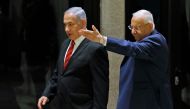 Israeli President Reuven Rivlin (R) and Prime Minister Benjamin Netanyahu (L) arrive for the a press conference in Jerusalem on September 25, 2019.  AFP / Menahem Kahana 
