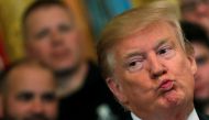 Donald Trump reacts after the release of Mueller report in the East Room of the White House, April 18, 2019. Reuters/Carlos Barria
 