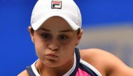 Ashleigh Barty of Australia hits a return against Sofia Kenin of the US during their third round women's singles match at the Wuhan Open tennis tournament in Wuhan on September 25, 2019. AFP / Hector Retamal

