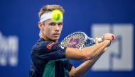 Alex de Minaur of Australia hits a return against compatriot John Millman during their men's singles first round match at the Zhuhai Championships tennis tournament in Zhuhai in China's southern Guangdong province on September 24, 2019. AFP 