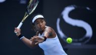 Naomi Osaka of Japan hits a return against Jessica Pegula of the US in their women's singles first round match at the WTA China Open tennis tournament in Beijing on September 29, 2019. / AFP / WANG ZHAO