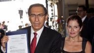  In this file picture taken on January 2, 2019 Peruvian President Martin Vizcarra (L), accompanied by Vice-President Mercedes Araoz, arrives at the Congress in Lima to deliver a bill that would declare the public prosecutor's office in a state of emergenc