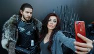A woman shoots a selfie with an actor dressed like Jon Snow before the screening of final episode of Game of Thrones on 20-meter-high screen at RZD Arena in Moscow, May 20, 2019. Reuters / Maxim Shemetov