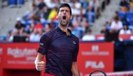 Serbia's Novak Djokovic reacts following a point against Belgium's David Goffin in their men's singles semi-final match at the Japan Open tennis tournament in Tokyo on October 5, 2019. / AFP / Kazuhiro Nogi 