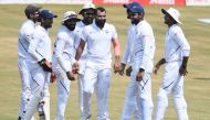 Indian cricketer Mohammed Shami (C) celebrates with teammates after the dismissal of South African cricketer Quinton de Kock during the fifth day's play of the first Test match between India and South Africa at the Dr. Y.S. Rajasekhara Reddy ACA-VDCA Cric