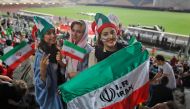 FILE PHOTO: Iranian women watch the World Cup Group B soccer match between Portugal and Iran at Azadi stadium in Tehran. AFP / ATTA KENARE
