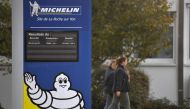 Employees arrive to take part in an information meeting focused on the site future on October 10, 2019 shows the Michelin factory in La Roche sur Yon.  / AFP / LOIC VENANCE 