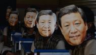 FILE PHOTO: Indian school students wear masks of China's President Xi Jinping in Chennai on October 10, 2019, AFP / ARUN SANKAR
