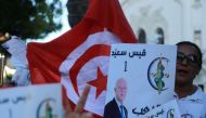 Supporters of Tunisian presidential candidate Kais Saied campaign on October 11, 2019 in Tunis. AFP / ANIS MILI