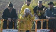 People react on October 14, 2019, outside Lledoners jail in Sant Joan de Vilatorrada, where Catalan leader Oriol Junqueras in jailed, after Spain's Supreme Court sentenced nine Catalan leaders to prison terms ranging from nine to 13 years for sedition and
