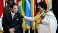FILE PHOTO: Zine el-Abidine Ben Ali of Tunisia meets Muammar Gaddafi of Libya as they pose for a family photo during the third European Union-Africa summit in Tripoli November 29, 2010. Reuters / Francois Lenoir
