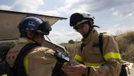 Firefighter Joan Herrera and nurse Vicenç Ferrés Padró of Prometeo test their technology to track health risks in the field, in Catalonia, Spain (IBM photo) 