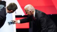 South Bend Mayor Pete Buttigieg leans in to a selfie taken by former Vice President Joe Biden with the crowd at the end of the fourth U.S. Democratic presidential candidates 2020 election debate at Otterbein University in Westerville, Ohio, October 15, 20