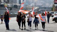 Lebanese demonstrators arrive to a gather on a highway linking Beirut to north Lebanon, in Zouk Mikael on October 19, 2019, one day after demonstrations swept through the eastern Mediterranean country to protest against dire economic conditions. AFP / JOS