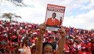  Botswana Democratic Party (BDP) supporter holds up a poster during an election campaign rally in Mokgweetsi Masisi's, President of Botswana and leader of the BDP, home village in Moshupa, on October 22, 2019. AFP / Monirul Bhuiyan 