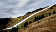 Picture shows a downhill slope, covered with conserved snow from last winter, at the Resterhoehe of Kitzbuehel ski resort, near Mittersill, Austria on October 20, 2019. AFP / JOE KLAMAR 