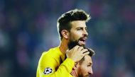 Barcelona's Lionel Messi celebrates scoring their first goal with Gerard Pique. Reuters/David W Cerny