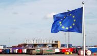 An EU flag flutters at the port of Zeebrugge after British police found bodies inside a lorry container in Grays, Essex, in Zeebrugge, Belgium October 24, 2019. Reuters/Francois Lenoir