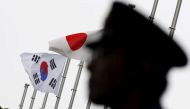 Japan and South Korea national flags at a hotel where South Korean embassy in Tokyo Japan is holding reception to mark the 50th anniversary of normalisation of ties, June 22, 2015. Reuters / Toru Hanai
