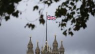 A Union flag flies over the Houses of Parliament in central London on October 29, 2019. AFP / Isabel Infantes
 