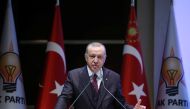 Turkish President Tayyip Erdogan addresses members of his ruling AK Party during a meeting in Ankara, Turkey, October 30, 2019. 